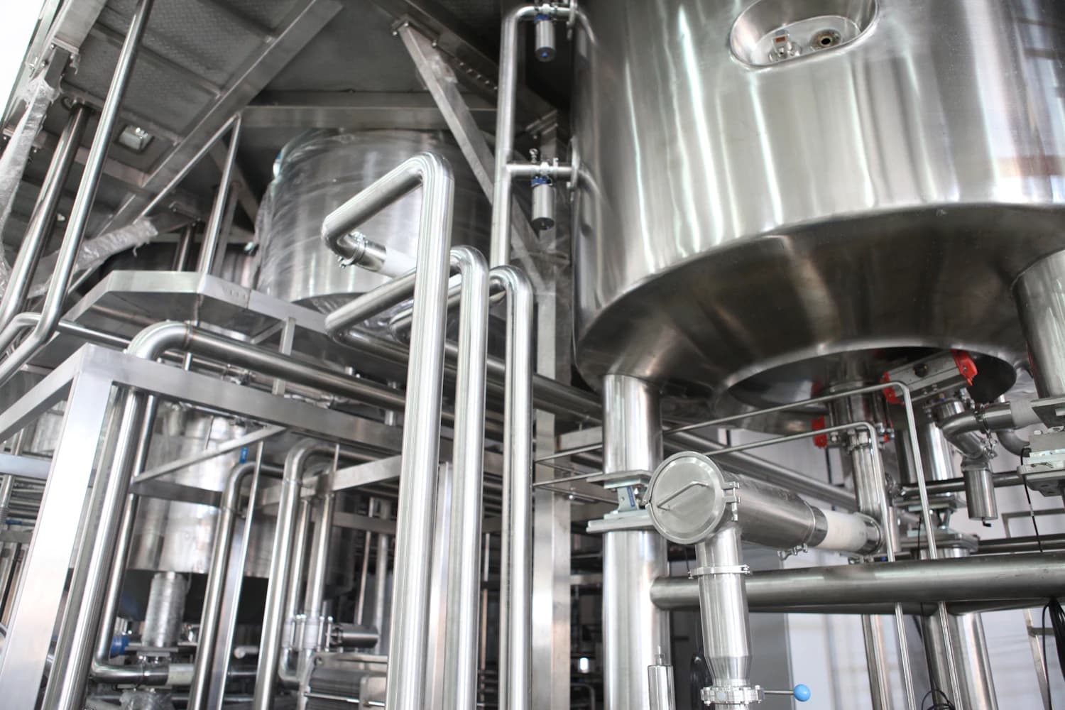 Industrial wash tanks and piping in a plant