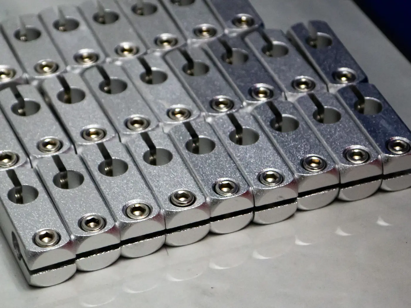 Conveyor line carrying metal parts through a plant