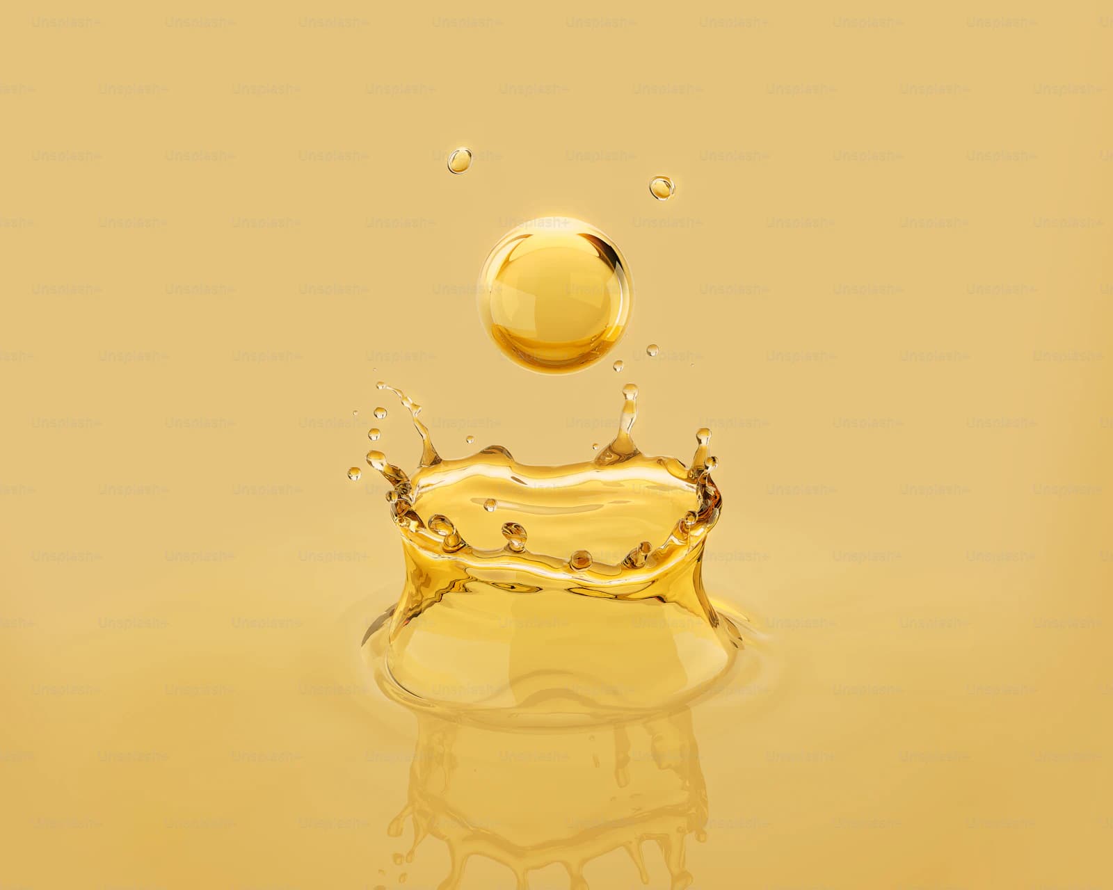 Golden rust-preventive oil droplet splashing, showing the protective film