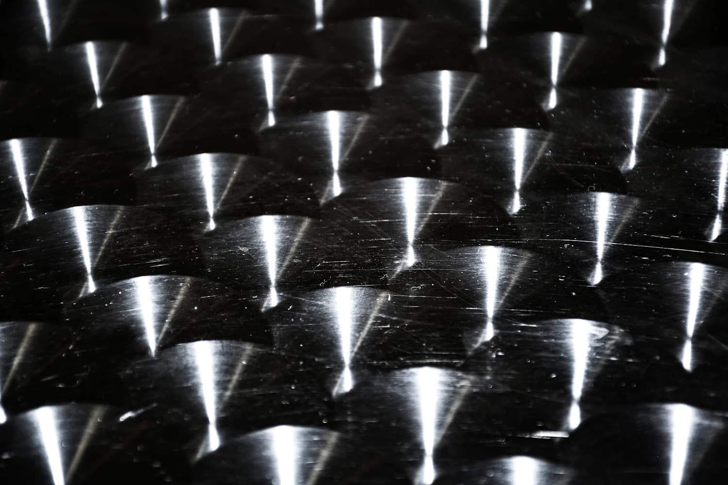 Rows of machined steel components with a protective rust-preventive finish