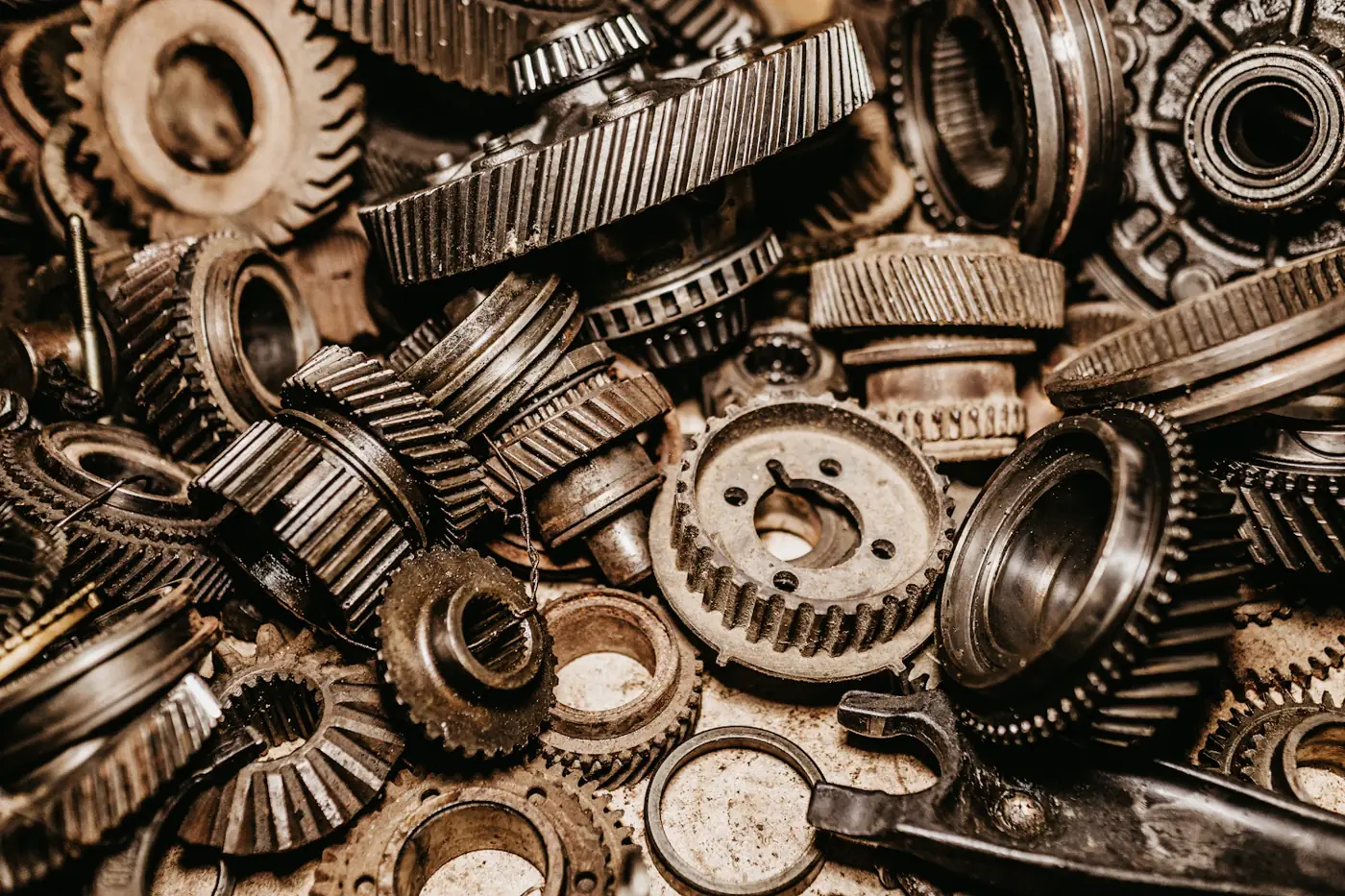 Oily machined gears and bearing races awaiting heavy-duty degreasing
